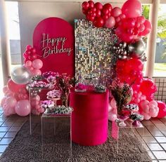 pink and silver birthday party decor with balloons