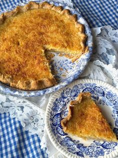 a blue and white plate with a pie on it