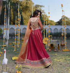 Traditional Wedding Lehenga with Choli and Dupatta is a beautiful Mehndi Dress that wins everyone's hearts at the very first glance with its charm. Embroidery, gotta, lacework, and goldwork give a perfect finishing look to the Lehenga Choli, making it an epitome of beauty. Embroidered Choli The choli is emblazoned with luxury designs and embroidery. Floral designs and threads give a chic look to the choli. Sequins, motifs, gotta, and goldwork makes this multi-colored choli a perfect choice to pa Gold Gown With Pallu For Traditional Ceremonies, Traditional Wedding Dress With Traditional Drape For Festive Occasions, Traditional Floor-length Wedding Dress, Traditional Wedding Dress With Zari Work For Eid, Floor-length Gown With Zari Work For Traditional Ceremonies, Floor-length Wedding Dress With Zari Work For Traditional Ceremonies, Traditional Festive Wedding Dress, Dabka Work Gown For Wedding And Navratri, Anarkali Set With Intricate Embroidery For Reception Festivals