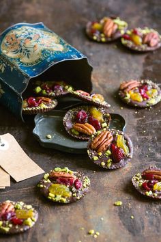 small cookies with nuts and cranberries are on the table