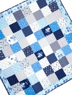 a blue and white patchwork quilt