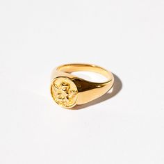 The Seraphina Ring is perfect for those who want a little bit of aristocrat in their look. A ring modelled on the iconic signet rings of old. This masculine style is made sweet with an innocent angel sitting atop it's centre. Pair it with something special or wear it with casual attire for a chic gold injection. Wear it on your pinky for extra edge or give it to a man you love. It is a perfect match with our Seraphina Pendant too! Angel Sitting, Gold Angel, Masculine Style, Signet Rings, Pinky Ring, Family Crest, Casual Attire, Wide Bands, Signet Ring