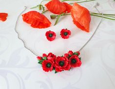 Poppy jewelry set Red poppy necklace gift Wildflower wedding Poppy gift Red poppies jewelry Red floral necklace Red flower necklace gift ♥This poppy necklace is perfect for an ethnic wedding. This necklace looks good with a wedding dress as well as a bridesmaid. A poppy necklace will be a good accessory for a theme party or other festive celebration. And if you like to be in the spotlight, then you can wear this necklace any other day. Good mood - I guarantee! Flowers poppies, made of polymer clay. For these flowers I used high quality polymer clay. Each flower is made by hand in a special technique. Flower part about 6 cm /2,36 Inches Length with chain 38.5 cm/15,16 Inches + 5 cm extension chain 5cm/ 1,96 Inches If this length is too short for you - write to me about it. I will make the l Red Jewelry For Valentine's Day Gift, Handmade Red Flower Jewelry, Handmade Red Jewelry Gift For Her, Handmade Red Jewelry As A Gift For Her, Handmade Red Jewelry For Mother's Day, Elegant Necklace With Handmade Flowers For Gifts, Red Jewelry For Mother's Day Gift, Red Flower-shaped Jewelry For Valentine's Day, Red Flower Shaped Jewelry For Valentine's Day