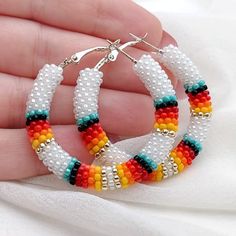 Bohemian White Beaded Hoop Earrings, Festival Colorful Beaded White Hoop Earrings, Festival White Hoop Earrings With Colorful Beads, White Hoop Earrings For Festival, Traditional White Hoop Earrings With Ear Wire, White Bohemian Small Hoop Beaded Earrings, White Bohemian Hoop Earrings With Colorful Beads, Handmade Bohemian Hoop Beaded Bracelets, Traditional White Hoop Earrings