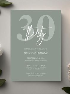 the 30th birthday party card is displayed next to some flowers and greenery on a table