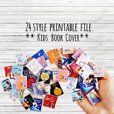 a hand holding a pile of children's book covers with the text, 25 style printable file kids book cover