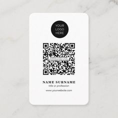 a black and white business card with a qr code in the center on a marble surface