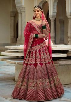 a woman in a red bridal gown