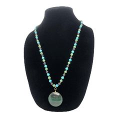 This exquisite handcrafted Kindness necklace is guaranteed to elicit a smile! Artfully constructed with real jade, stone, and beads, this stunning piece of jewelry is a reminder of the joy of benevolence. The cheerful warmth of the beads symbolizes the kindness we all share. A thoughtful present for anyone seeking to express their benevolent spirit, the Kindness necklace is an inspiring gift!. Length: 15" Turquoise Bohemian Jade Beaded Necklaces, Bohemian Jade Pendant Necklace, Bohemian Hand-strung Jade Necklace, Bohemian Style Hand-strung Jade Necklaces, Turquoise Jade Hand-strung Beaded Necklace, Jade Pendant, Nature Jewelry, Green Bead, Inspirational Gifts