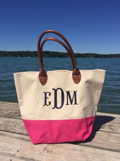 "Monogrammed Tote Bags by Deshler Designs This tote bag makes the perfect gift for any occasion. Available in 3 fun colors and big enough to fit all your necessities. Monogram included...you could do a 3-letter monogram, name, or single large initial. Match the bag color, or choose another color of your choice! Material: Canvas, Pleather Accents Dimensions: 18\"W x 12.5\"H x 9.5\"D One open compartment with one interior pocket Handle Drop: 6\" **lime green & hot pink have sold out Please inc Customizable Pink Bag For Shopping, Personalized Pink Bag For Everyday, Customizable Pink Shopping Bag, Personalized Pink Bags For Everyday, Personalized Monogram Tote Bag, Pink Monogrammed Bag As Gift, Customizable Rectangular Bags, Pink Monogram Bag As Gift, Everyday Canvas Monogram Bags