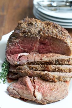 a large piece of meat sitting on top of a white plate