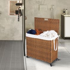 a wicker laundry basket sitting on top of a tiled floor