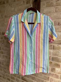 ⛵️rainbow button up  Classic  ⛵️label: Koret  Tag size: none  Care: machine wash  Content: none (Cotton/ poly) No stretch  Bust:40" Waist:42" Hip:42" Length:24" Shoulder:15" Bicep: 15" ⛵️slight pilling here and there 80s Button Up Shirt Outfit, Rainbow Cotton Shirt For Summer, Retro Rainbow Tops For Spring, Colorful Short Sleeve Cotton Blouse, Rainbow Print Short Sleeve Shirt, 1980's Outfits, 80s Tops, 80s Clothes, Nikki Dress