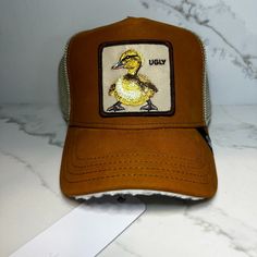 New Goorin Bros Farm Trucker Hat - Ugly Duckling "Dugling" Tan Snap Back New With Tags Yellow Trucker Baseball Cap For Outdoor, Yellow Trucker Baseball Cap, Casual Yellow Trucker Hat With Short Brim, Casual Yellow Short Brim Trucker Hat, Yellow Trucker Hat With Curved Brim, Goorin Bros, Ugly Duckling, Snap Back, Snap Backs