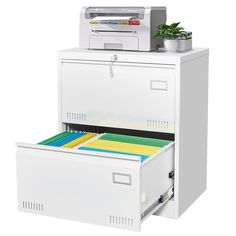 two white filing cabinets with file drawers and a printer on the top one is open