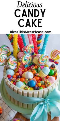 a cake with lots of candies and lollipops in it