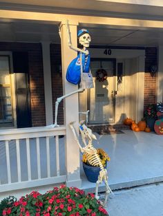 a skeleton is holding a bucket full of pumpkins on the front porch as if it were waiting for someone to leave