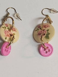 Handmade button dangle drop earrings, Wood floral buttons and pink buttons earrings dangle with jump rings attached. Ear wire closure.  For pierced ears. Fun earrings to dress up outfits for any occasion.. Gift for her, Gift for mom. Buttons Earrings, Earrings Wood, Dress Up Outfits, Button Earrings, Pink Earrings, Wood Earrings, Floral Earrings, Fun Earrings, Rose Design