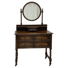 an old dresser with a mirror on top