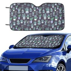 a blue car with cactus plants on the front and back windshield sunshade cover