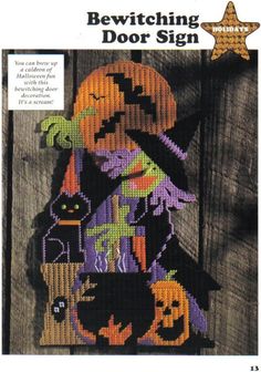 an image of a cross stitched halloween scene with pumpkins and witches on it