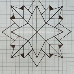 an intricate design made out of squares and triangles