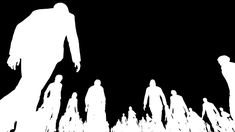 a group of people standing in front of a black and white silhouette of a giantfoot