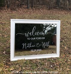 a white framed mirror with the words welcome to our forever written in cursive writing