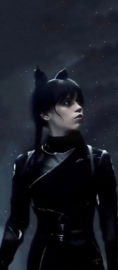 a woman with black hair and cat ears in a dark costume, standing in the rain