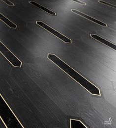 a black floor with gold lines on it