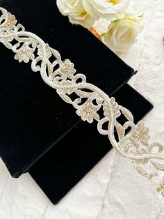 Indian Bead Lace Trim White Beaded Costume Wedding Dress Sash tapes lace trim ribbon Hair Accessories, Bridal Belt, Wedding Gown Decoration Crafting Sewing  This is exclusive beaded trim Handcrafted, has been hand embroidered. A perfect embellishment for a bridal dresses or for festive mood outfit a Trim . This Trims will add mystique to your fabric, you can use this lace alone or add it with other laces to create a new unique design for Wedding dress. This Embellishment Border/ Lace for your wedding dresses  FR-2006 This stunning lace trim is great for any sewing and craft projects : ➤dress border, dupattas, scarves and veils  ➤headband, hats ➤Jewelry making, ➤For making a DIY belt ➤book binding embellishment,  ➤designing stylish blouses, ➤waist belt to match your plain outfit  ➤shrugs, s Elegant Embroidered Party Trims, Elegant Embroidered Border Trims For Party, Elegant Trims With Embroidered Border For Party, Elegant Party Trims With Embroidered Border, Traditional Embellished Trims For Wedding, Festive Embroidered Bridal Belt, Elegant Embroidered Wedding Trims, Elegant White Embroidered Bridal Belt, Fitted White Lace Bridal Belt