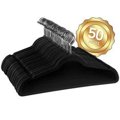 a black suit hanger with 50 pieces of clothes on it and a gold seal