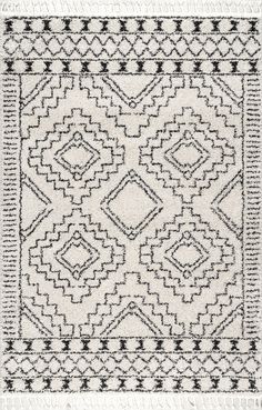 a black and white rug with an intricate design