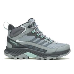 the women's water shoe is grey and has light green laces on it