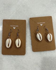 These are handmade Puka Shells. These earrings are perfect for any occasion. They are also lightweight. I love the beach and enjoy all the wonderful shells in Florida so I put them to good use! I hand make all of my products. Casual Shell Jewelry Gift, Vacation Shell-shaped Earrings With Ear Wire, Handmade Beachy Earrings For Summer, White Shell-shaped Earrings For Vacation, Casual White Shell As A Gift, Handmade Summer Earrings For Vacation, Summer Shell Jewelry For Gifts, Handmade Shell For Summer Beach, Handmade Shell For Beach In Summer