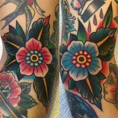 the legs are covered with tattoos and flowers