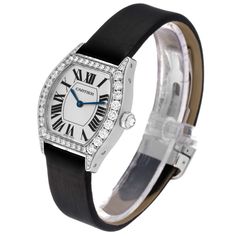 Cartier Tortue 18k White Gold Diamond Black Strap Ladies Watch WA507231. Manual winding movement. 18K white gold case 34.0 x 28.0 mm. Octagonal crown set with the diamond. Diamond lugs.Transparent sapphire crystal caseback. 18K white gold bezel factory Cartier diamonds. Scratch resistant sapphire crystal. Silver sunray silver dial with Roman numerals. Blue sword shape hands. Secret signature at X. Black leather strap with 18K white gold deployant buckle. Cartier White Gold Watch With Brilliant Cut, White Gold Watches With Diamond Hour Markers For Evening, Classic Diamond White Watch For Evening, Cartier Watches With Polished Finish For Evening, Cartier Diamond Watch With Chronometer For Formal Occasions, Cartier Watches With Subdials For Evening, Elegant White Gold Diamond Watch With Chronometer, Evening White Gold Watch With Chronometer, Cartier Watch With Diamond Hour Markers For Evening