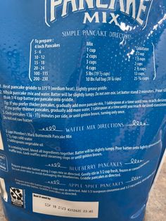 the back side of a blue bucket with instructions for how to make pancake mix