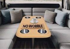 there is a no wobble sign on the coffee table in the back of a camper