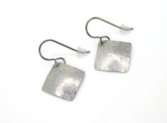 "The perfect daily go-to earrings! These handmade hammered square earrings are made with Commercially Pure Grade 1 Titanium. The angled square earrings have a slight curve to them and they have been tumbled giving them a reflective shine. For your nickel free ear wires, choose either niobium (for extra sensitive ears) or pure titanium from the drop-down menu. These earrings are very lightweight, nickel free, and hypoallergenic, making them comfortable for anyone to wear. This style earring can b Silver Square Hypoallergenic Earrings, Silver Hypoallergenic Square Earrings, Hypoallergenic Silver Square Earrings, Silver Hammered Rectangular Earrings, Extreme Metal, Titanium Jewelry, Titanium Earrings, Square Earrings, Sensitive Ears