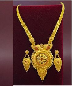 Elevate your style with this exquisite 22K gold plated traditional necklace set, perfect for special functions, weddings, or festive occasions. Designed with intricate craftsmanship, this necklace set reflects the beauty of Indian bridal jewelry. The vibrant golden hues and detailed motifs make it an ideal choice for a regal look. This set includes matching earrings to complete your ensemble, making you stand out in any celebration. The lightweight design ensures comfort without compromising ele Gold Plated Bridal Sets Gift, Gold Plated Round Bridal Sets As Gift, Gold Plated Yellow Gold Kundan Necklace For Puja, Traditional Gold Plated Jewelry As Gift, Traditional Gold Kundan Necklace With Elegant Design, Traditional Gold Jewelry As A Gift, Traditional Gold Jewelry For Gift, Gold Traditional Jewelry Sets For Formal Occasions, Gold Meenakari Bridal Necklace For Formal Occasions