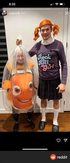 a girl standing next to an orange fish in a plastic bag