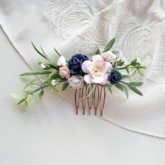 Navy blue flower comb, of artificial flowers  This a beautiful and delicate hair accessory for brides and a nice gift to the bridesmaids   On the wedding day, every bride wants to look fantastic. This navy blue flower hair comb, will be a magical addition to your look on your happiest day.  This will emphasize the ease of your image.  The comb is very conveniently attached to the hair and fits in with any hairstyle.  -Material- artificial flowers and artificial greenery  -Colors- navy blue, blush pink, white, greenery - Unique handmade.  Wedding - is one of the most important events in the life of any girl I am happy to try to make the most beautiful decoration for you, to make you feel the most beautiful bride. You deserve the best! Bridal Hair Pieces Flower, Floral Hair Piece, Floral Wedding Hair, Floral Hair Pieces, Navy Blue Flowers, Floral Hair Combs, Artificial Greenery, Flower Comb, Flower Hair Comb