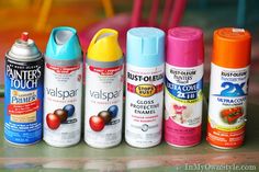 several different types of spray paint on a table