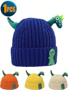 three different colored knitted hats with small dinosaurs on the front and one has a green dinosaur