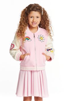 Bursting with retro charm, the Groovy bomber jacket is an outer layer she’ll actually want to wear. The contrasting white sleeves pop against the ballerina pink body. Cheerful rainbow colored patches complete the look. Model is wearing a size 6T. Fabric Content: 51% Cotton 49% Polyester Imported Style: CG247-CHK3136-BA Spring Cotton Varsity Jacket With Patchwork, Casual Spring Varsity Jacket With Patches, Casual Varsity Jacket With Patches For Spring, Fun Pink Long Sleeve Outerwear, Fun Pink Spring Outerwear, Spring Long Sleeve Varsity Jacket With Patches, Spring Varsity Jacket With Patches And Long Sleeves, Cute Spring Outerwear For School, Cute Patchwork Outerwear For Spring