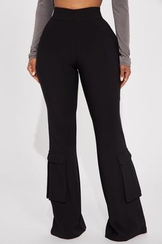 Available In Black. Flare Pant High Rise Pull On Waistband Elastic Back Cargo Pockets Shell 95% Polyester 5% Spandex Lining 100% Polyester Imported | Strut This Cargo Flare Pant in Black size XS by Fashion Nova Mid-rise Elastane Yoga Pants With Pockets, Mid-rise Yoga Pants With Pockets, Black High Stretch Bottoms With Side Pockets, High Stretch Black Bottoms With Side Pockets, Black High-stretch Bottoms With Side Pockets, Versatile Fitted Black Cargo Pants, Black Athleisure Pants With Side Pockets, High Waist Elastane Yoga Pants With Pockets, Black Pants With Side Pockets In Elastane