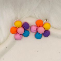 Sweet earrings that will bring a pop of color to any outfit! These durable and lightweight handmade earrings feature colorful flowers with rainbow petals. Make sure to check out our other listings for fun and unique earrings to add to your collection! Note: Handmade items may vary slightly from pictures, including colors. Happy Rainbow Flower Earrings, Trendy Multicolor Flower Earrings, Multicolor Handmade Flower Earrings, Whimsical Multicolor Flower Charm Earrings, Fun Pink Polymer Clay Earrings, Playful Multicolor Handmade Flower Earrings, Handmade Multicolor Flower Earrings, Cute Multicolor Flower Shaped Earrings, Playful Handmade Multicolor Flower Earrings