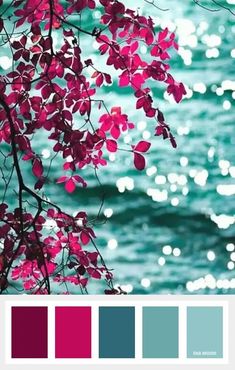 the color scheme is blue, green and purple with some red leaves on it in front of water