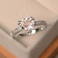 an engagement ring in a box with diamonds